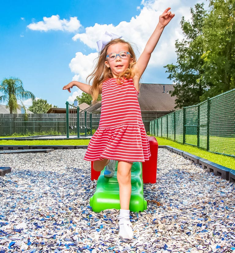 Child playing on Jelly Bean Rubber Mulch